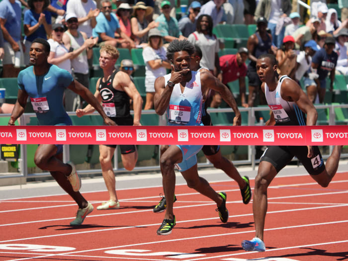Noah Lyles points to the scoreboard after defeating Erriyon Knighton and Fred Kerley in the 200m at nationals.